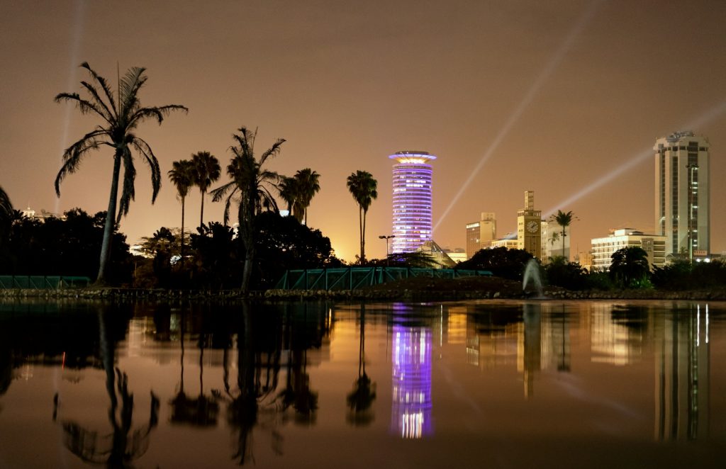 Body of water near green trees at night in Nairobi, Kenya